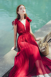 Sleeveless pleated silk maxi dress with ruffle shoulder detail and deep V neckline